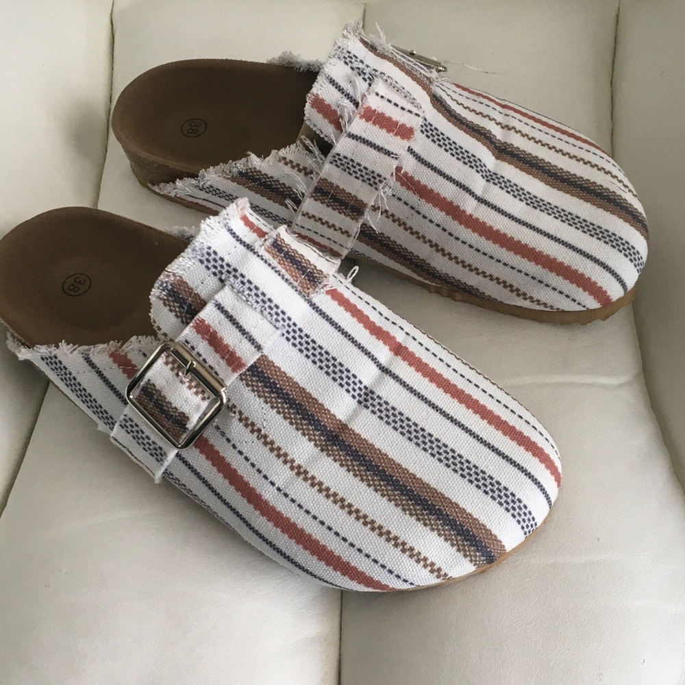 Striped Canvas Slip-On Clogs in White, Rust, Blue, and Brown.